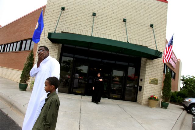 ELIZABETH FLORES¥ eflores@startribune.com

June 12, 2009 - Burnsville, MN - Amar Rashid, 14, left, and his brother Zuber Yusuf, 7, of Burnsville waited outside the new Islamic Institute of Minnesota Mosque after a prayer service.